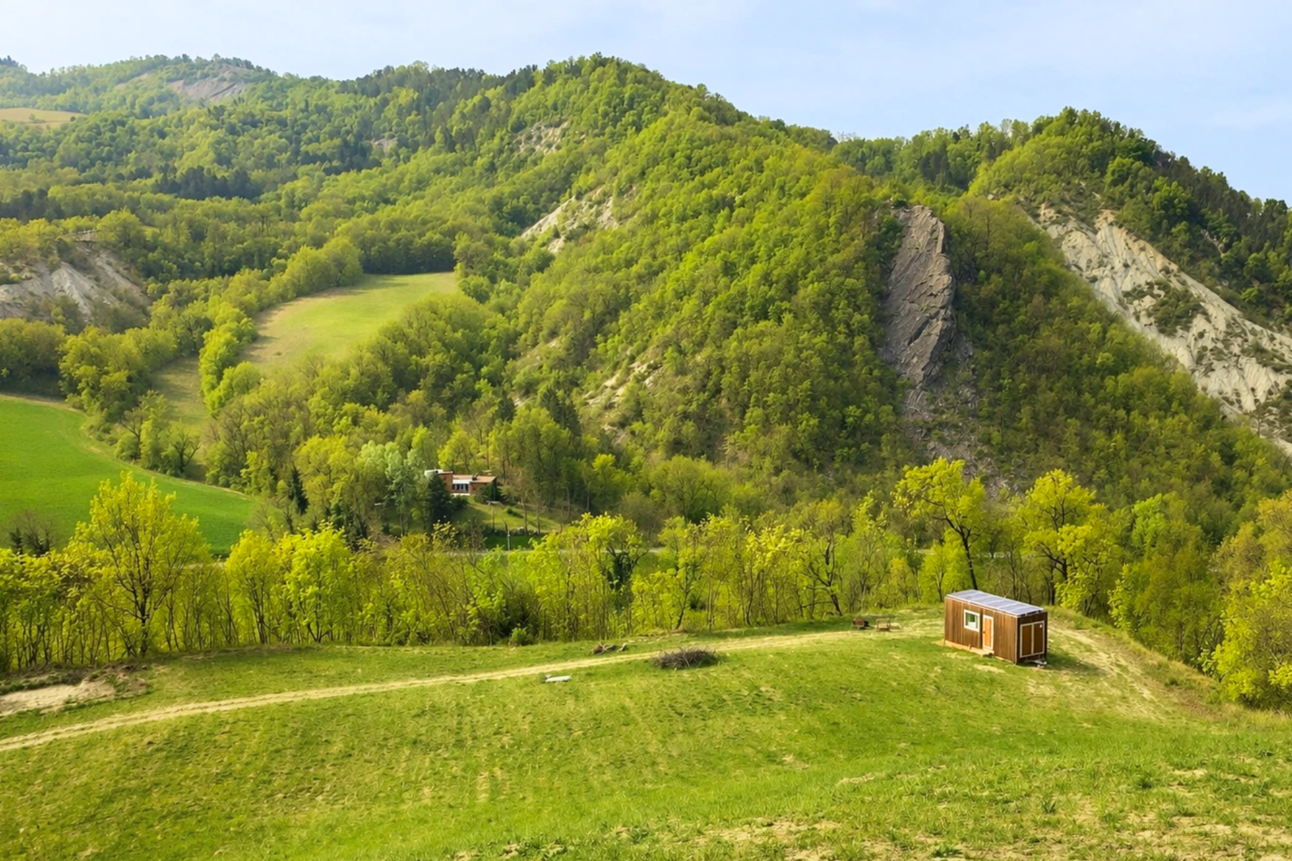 Cabin in nature among wild plum trees and green meadows in Val Tidone